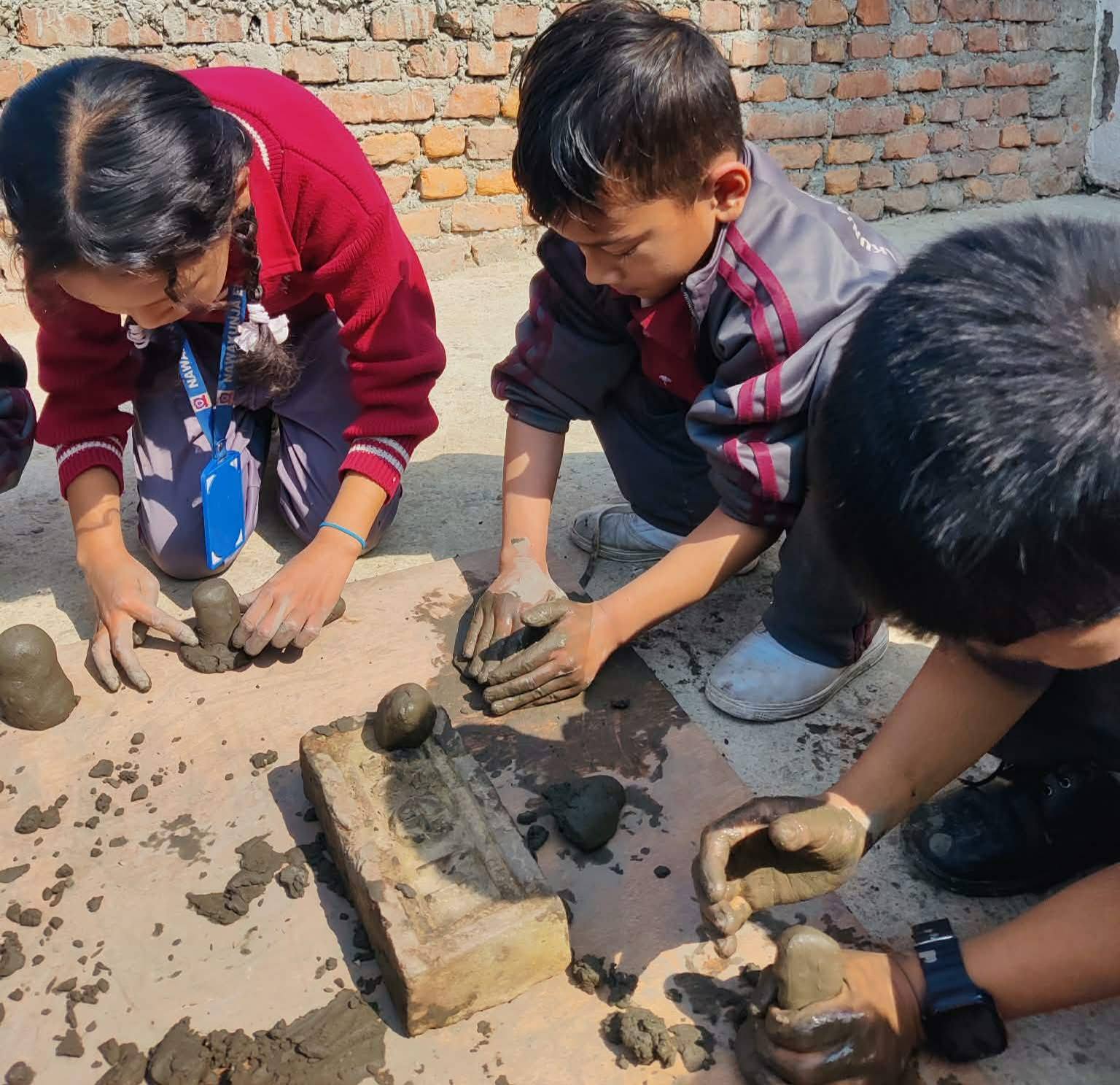 Nawakunja students working with clay — hands-on activity-based learning
